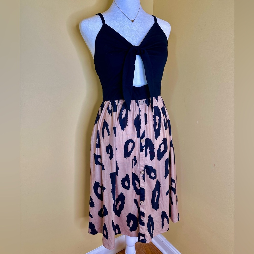 Leopard print dress with a twist front.